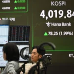 Asia stocks face an AI bubble threat in 2026. Experts monitor high valuations and policy shifts as investors pivot toward regional laggards and defensive assets.