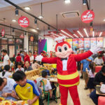 Jollibee plans to list its international business on a US stock exchange by 2027 to fuel global growth and compete with world-class fast-food giants.