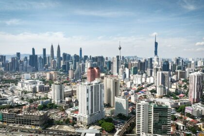 Malaysia reviews the impact of a new US tariff following a Supreme Court ruling. The government seeks to protect exporters and 233 billion ringgit in trade.