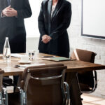 Executives in a boardroom discussing corporate governance and new SEC regulatory compliance standards.