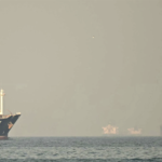 Tankers moving through the Strait of Hormuz, a critical maritime chokepoint for the global oil supply chain.