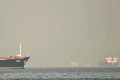 Tankers moving through the Strait of Hormuz, a critical maritime chokepoint for the global oil supply chain.