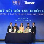 Representatives from MIK Group and Turner signing a strategic partnership agreement during a ceremony in Hanoi.