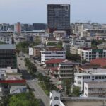 A wide aerial view of Kota Kinabalu city buildings and infrastructure managed by MINDET in Sabah.