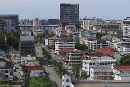 A wide aerial view of Kota Kinabalu city buildings and infrastructure managed by MINDET in Sabah.