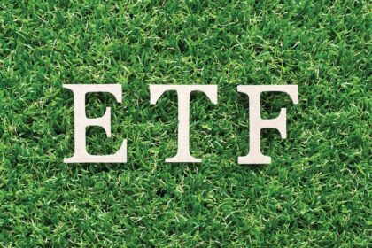 The letters ETF resting on green grass, representing sustainable investment and the MarketVector Vietnam Local Index.