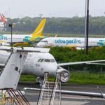 An aircraft from PAL and Cebu Pacific parked at the tarmac, highlighting regional aviation and fuel security.