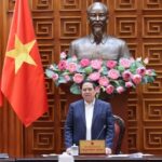Prime Minister Pham Minh Chinh leading a meeting in Hanoi to stabilize the national fuel price and energy supply.