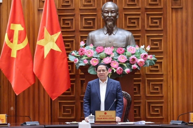 Prime Minister Pham Minh Chinh leading a meeting in Hanoi to stabilize the national fuel price and energy supply.