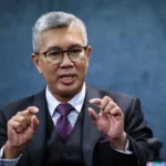 A fluctuating oil price creates a unique fiscal paradox for Malaysia, balancing increased export revenue against rising subsidy costs and global trade risks.