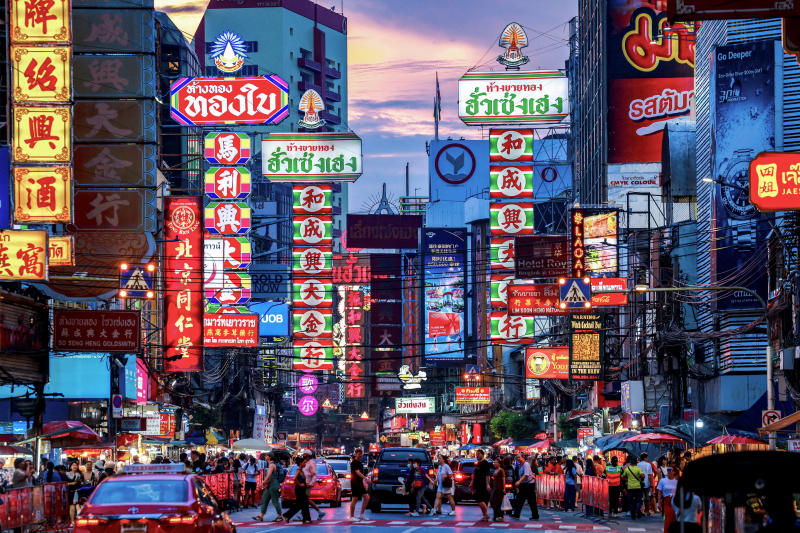 A vibrant street scene in Bangkok's Chinatown, showcasing the domestic economy managed by the central bank.