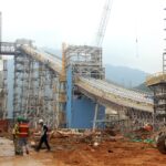 Construction workers monitor the site of a major thermal power project developed by EVN to ensure energy security.