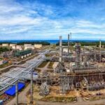 Aerial view of a coastal refinery complex, highlighting the scale of Vietnam's national energy centers.