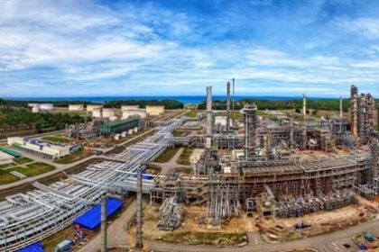 Aerial view of a coastal refinery complex, highlighting the scale of Vietnam's national energy centers.