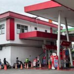 An Indonesian Pertamina petrol station serving motorists, representing regional energy security and fuel supply.