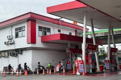 An Indonesian Pertamina petrol station serving motorists, representing regional energy security and fuel supply.