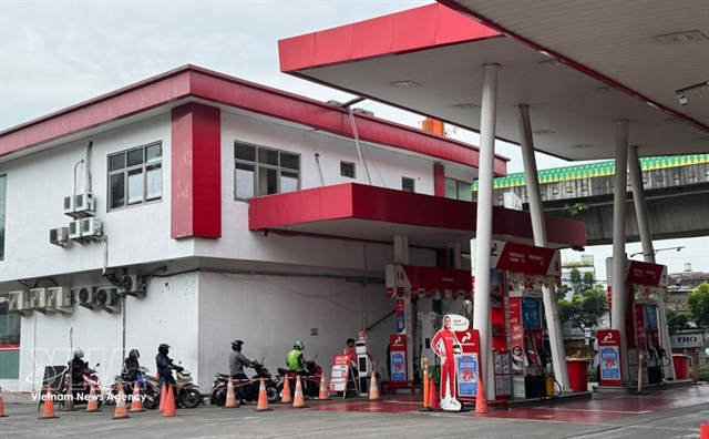 An Indonesian Pertamina petrol station serving motorists, representing regional energy security and fuel supply.