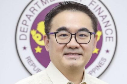 A portrait of Finance Secretary Frederick Go in front of the Department of Finance seal in the Philippines.