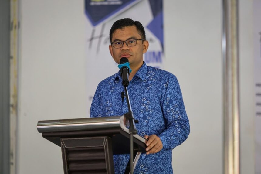 Akmal Nasrullah speaking at a podium, providing government updates on the nationwide B20 biodiesel rollout.