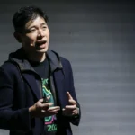 CEO Anthony Tan presents AI innovations for Grab during the GrabX event to improve merchant and driver efficiency.