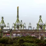 Port cranes and containers at Keppel Terminal will be relocated to make way for the Greater Southern Waterfront project.