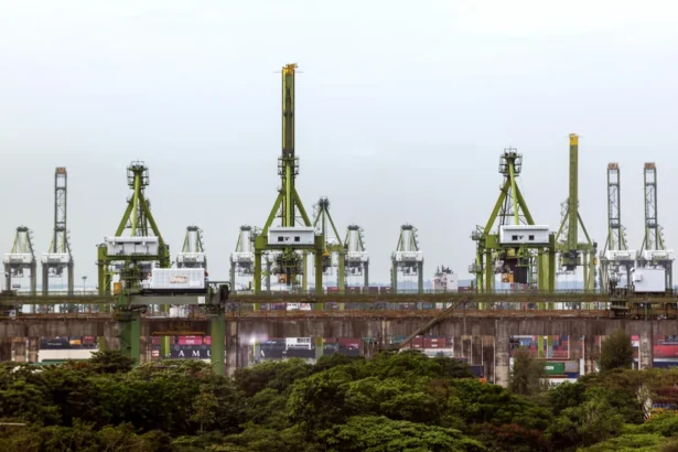 Port cranes and containers at Keppel Terminal will be relocated to make way for the Greater Southern Waterfront project.