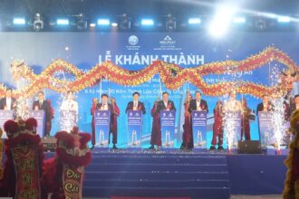 Dignitaries and dragon dancers celebrate the grand inauguration of the new steel plant by Hoa Phat in Tay Ninh.