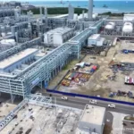 An aerial view of the Lotte Chemical Indonesia New Ethylene complex, highlighting massive industrial infrastructure.