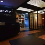 The modern interior of a Pizza Hut Indonesia office or outlet, highlighting the brand's local corporate identity.