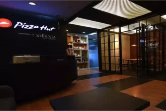 The modern interior of a Pizza Hut Indonesia office or outlet, highlighting the brand's local corporate identity.