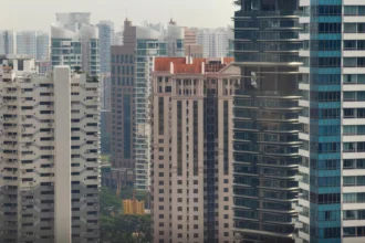 Modern high-rise residential buildings in Singapore, highlighting the latest trends in the private home market.