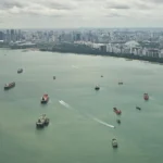 Cargo ships in the Singapore Strait, representing the critical global trade interests defended by SBF.