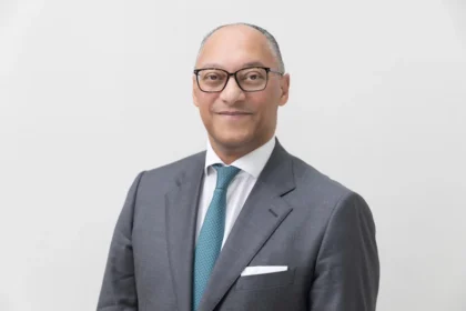 Portrait of Andreas Berger, group CEO of Swiss Re, who provides expert analysis on global economic volatility.