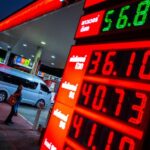 Fuel price display at a Thai gas station as the state seeks to borrow funds to mitigate economic risks.