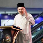Prime Minister Anwar Ibrahim discussing Budget 2027 fiscal strategies at a podium