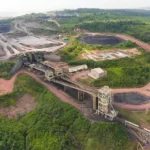 An aerial view of a sprawling coal mining facility representing the strategic infrastructure assets of BIPI.