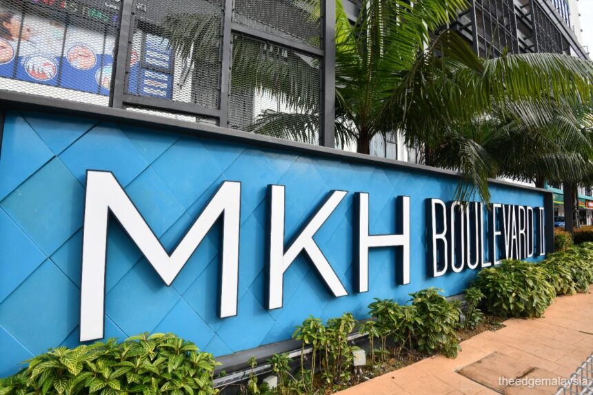 An outdoor sign of MKH Boulevard representing the property assets being integrated under the Batu Kawan corporate acquisition.