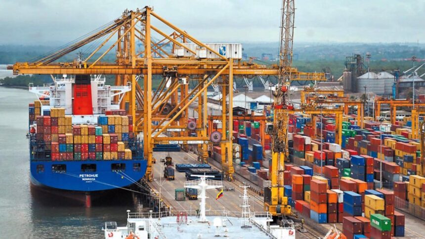 Container ship at a busy port, loading electronics for export.