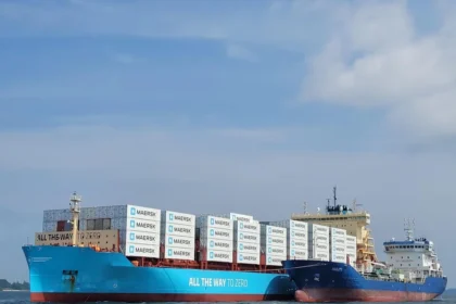 Maersk container ship and tanker at sea, showcasing vessels that rely on marine fuel for global logistics operations.