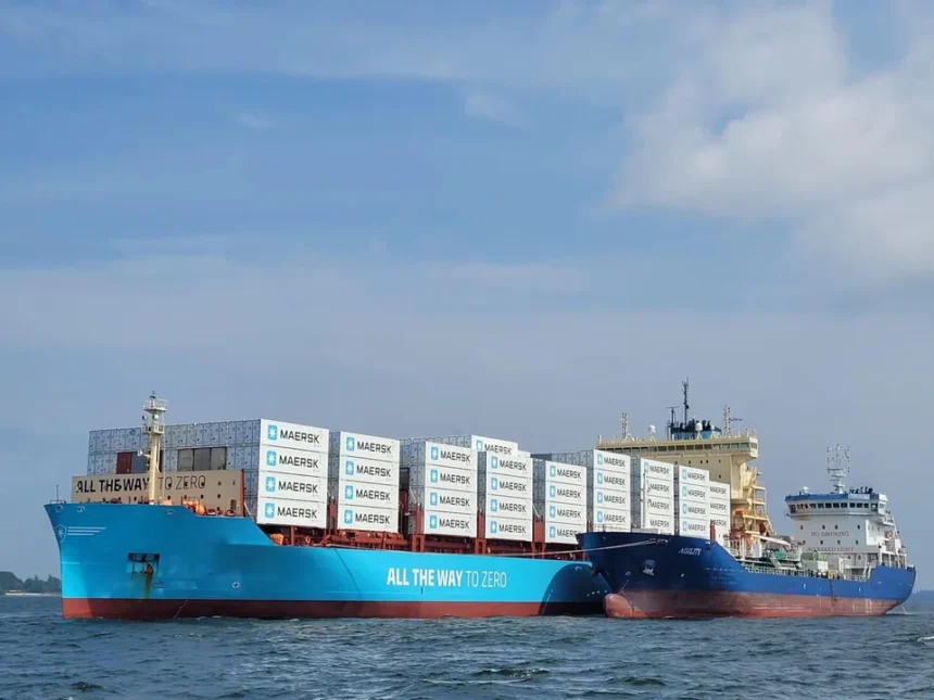 Maersk container ship and tanker at sea, showcasing vessels that rely on marine fuel for global logistics operations.