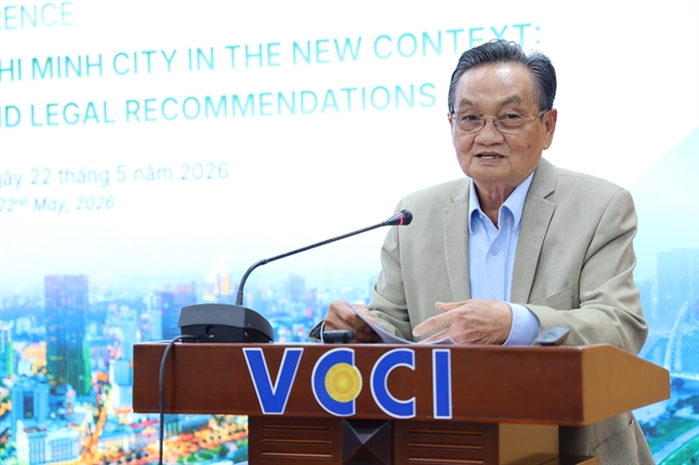 Dr. Tran Du Lich speaks at a business convention regarding incoming investment opportunities throughout HCM City.