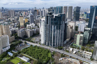 Aerial view of the modern Manila cityscape, a primary engine of the dynamic and growing PH economy