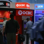 People use ATMs from major Singapore banks DBS, OCBC, and UOB