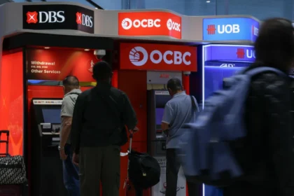 People use ATMs from major Singapore banks DBS, OCBC, and UOB
