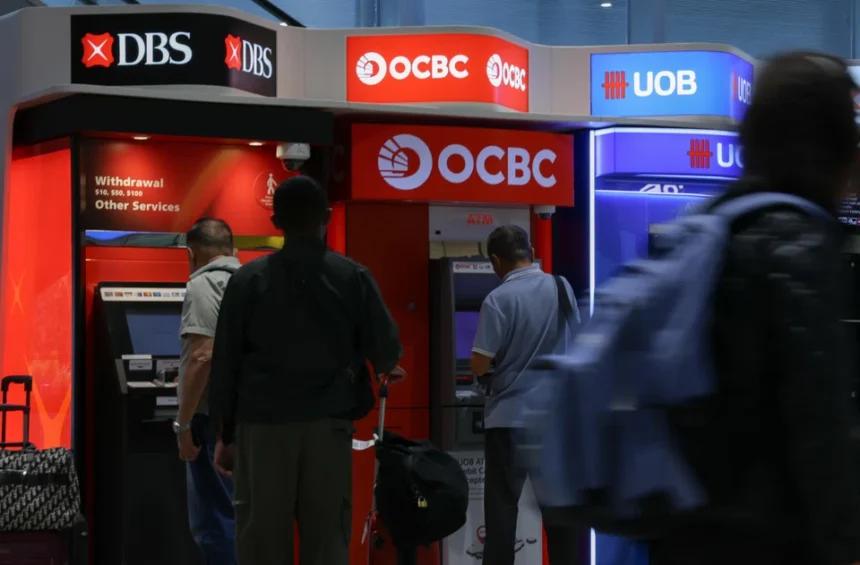 People use ATMs from major Singapore banks DBS, OCBC, and UOB