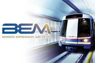 An underground metro train traveling through a tunnel next to the official BEM corporate brand logo.