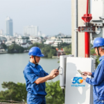 Technicians install 5G equipment on a rooftop to expand high-speed broadband coverage across the city.
